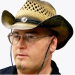 Western cowboy hat with curved brim, decorative cord, and center medallion for cowboy and rodeo costumes.