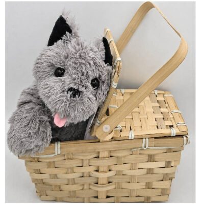 Wizard of Oz Toto costume accessory featuring a gray plush dog inside a natural woven bamboo basket with hinged lid and carrying handle.