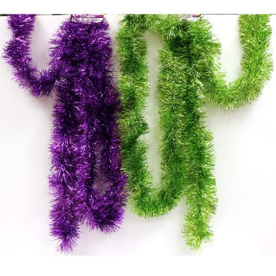 Purple or Lime Green Tinsel Garland is shiny and measures 4" x 9'. Put this around your tables, frame a door way or wear it for a funny picture!