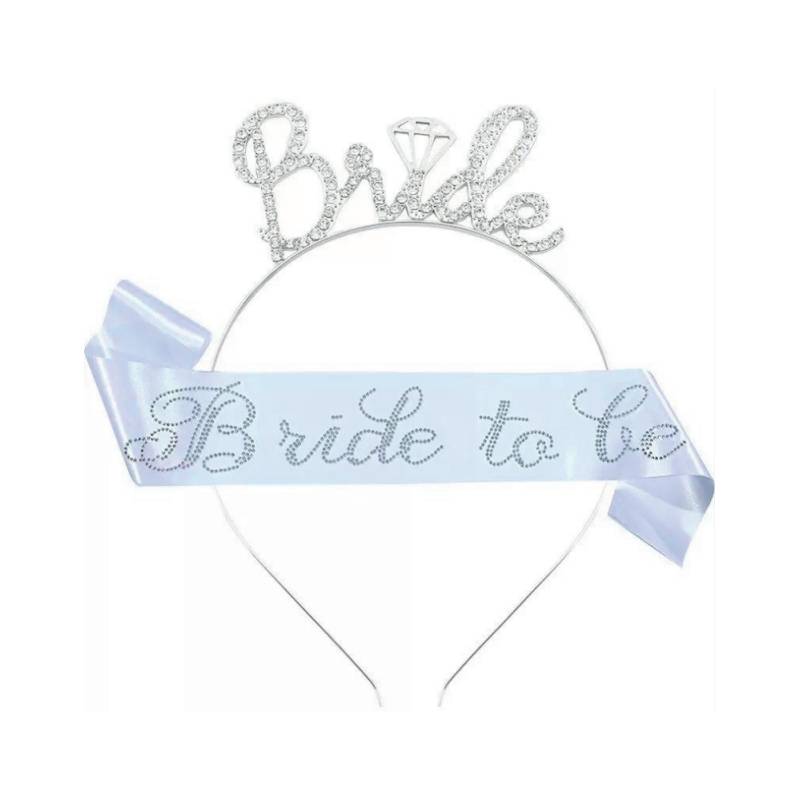 Bride To Be Deluxe Crown & Sash Set featuring a sparkling silver “Bride” tiara with diamond-ring detail and a white sash with silver lettering.