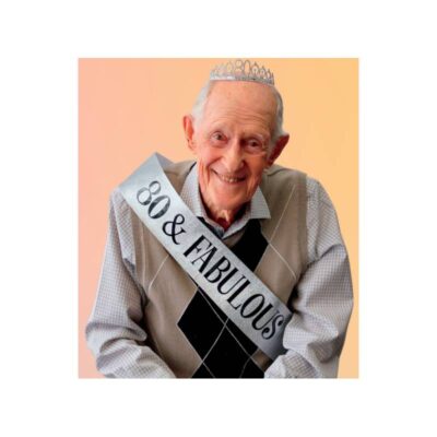 Adult wearing the 80 & Fabulous Deluxe Crown & Sash Set with a sparkling silver-tone 80 tiara and matching silver birthday sash.