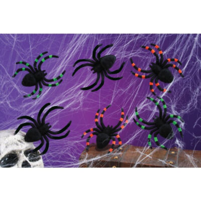 4 by 5 inch flocked plastic tarantula spiders with fuzzy black bodies and assorted colored legs on Halloween web décor.